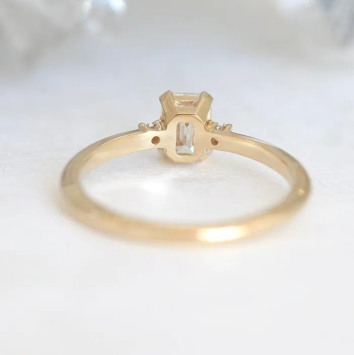 Capucinne Rings Sleek Simple EmeraldCut Diamond Ring With Side Diamonds