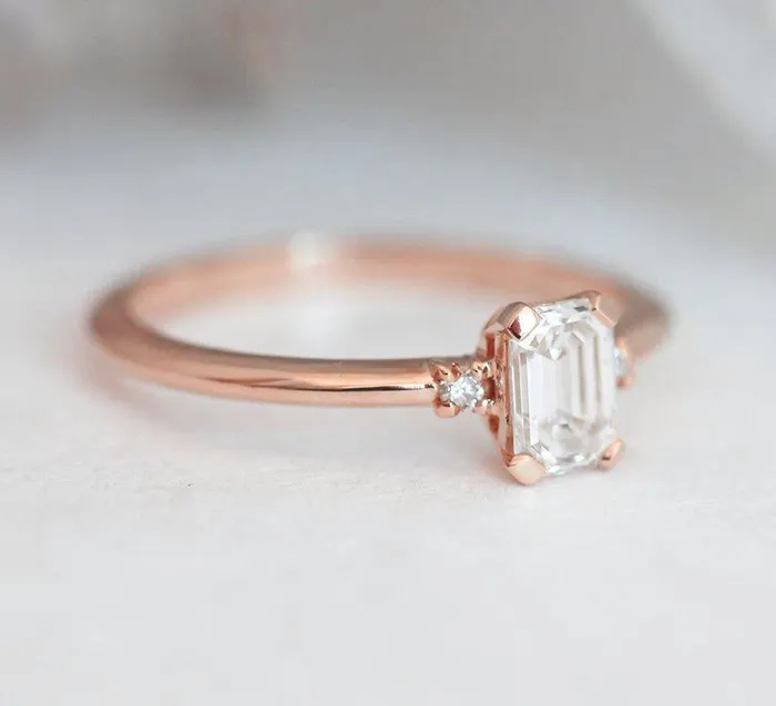 Capucinne Rings Sleek Simple EmeraldCut Diamond Ring With Side Diamonds