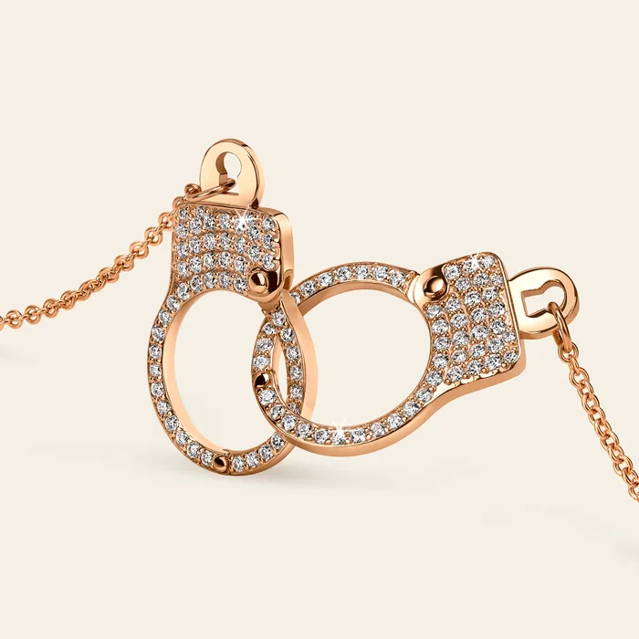 Hand crafted in 18k rose gold and set with 100 highquality round brilliant cut diamonds Necklaces Love Lockdown Interlocking Diamond Necklace