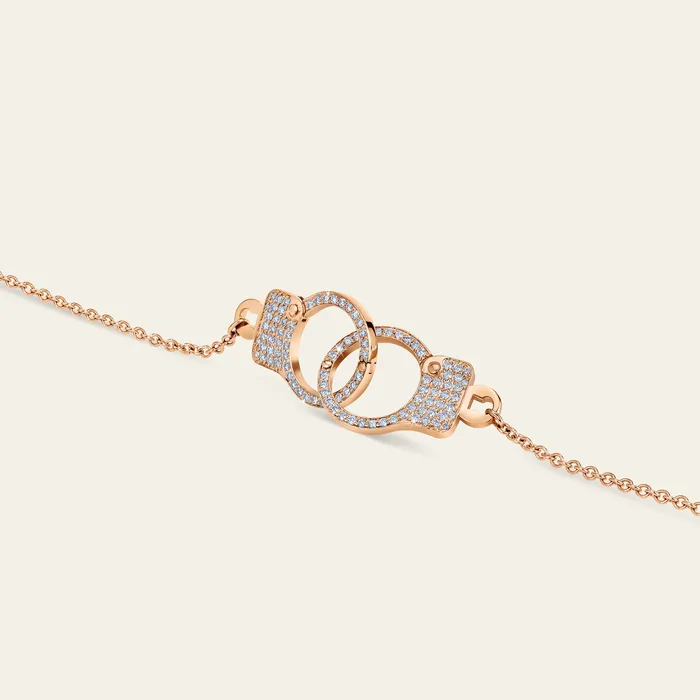 Hand crafted in 18k rose gold and set with 100 highquality round brilliant cut diamonds Necklaces Love Lockdown Interlocking Diamond Necklace